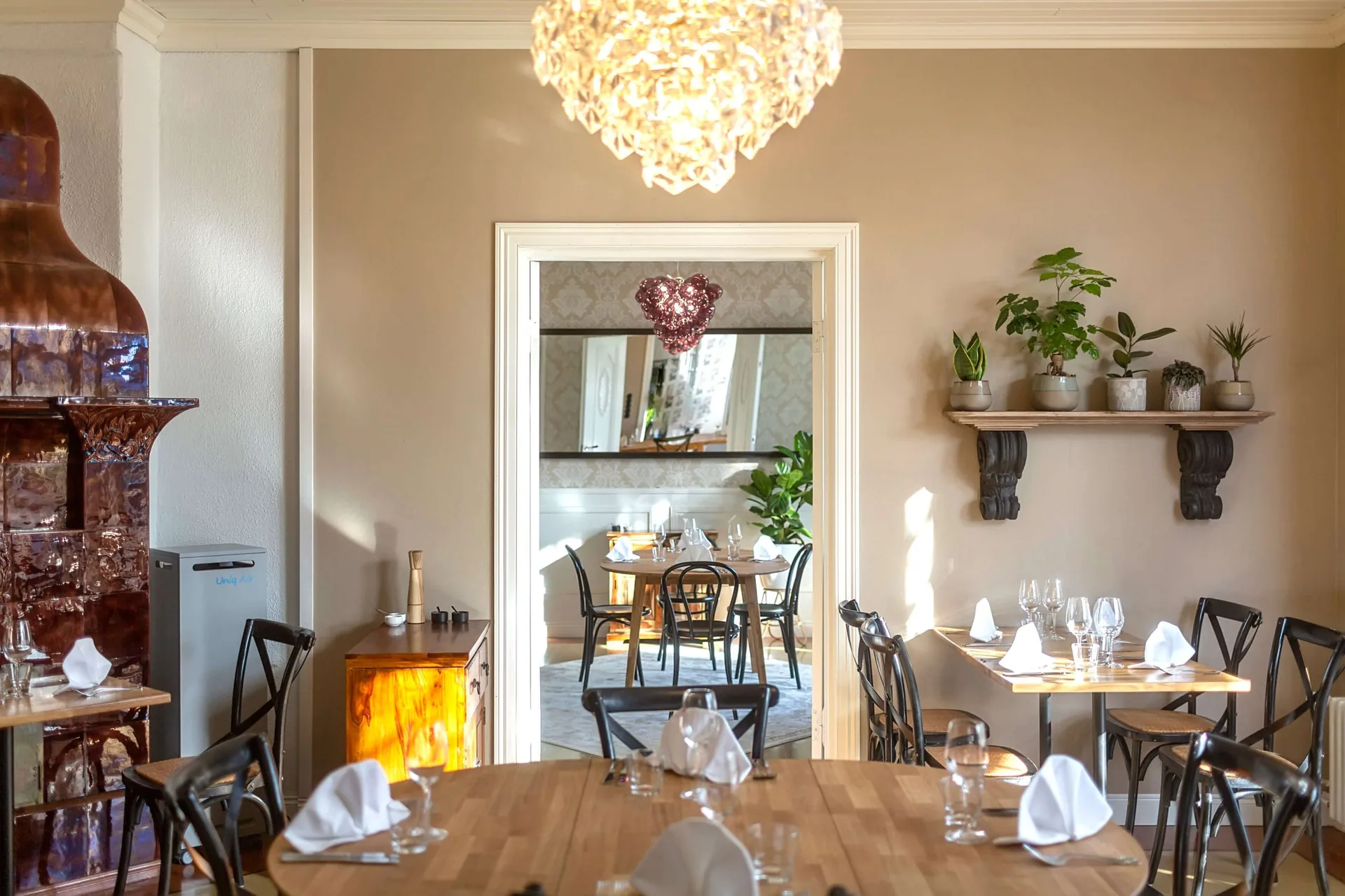 Villa Lilla dining room and original tiled stove